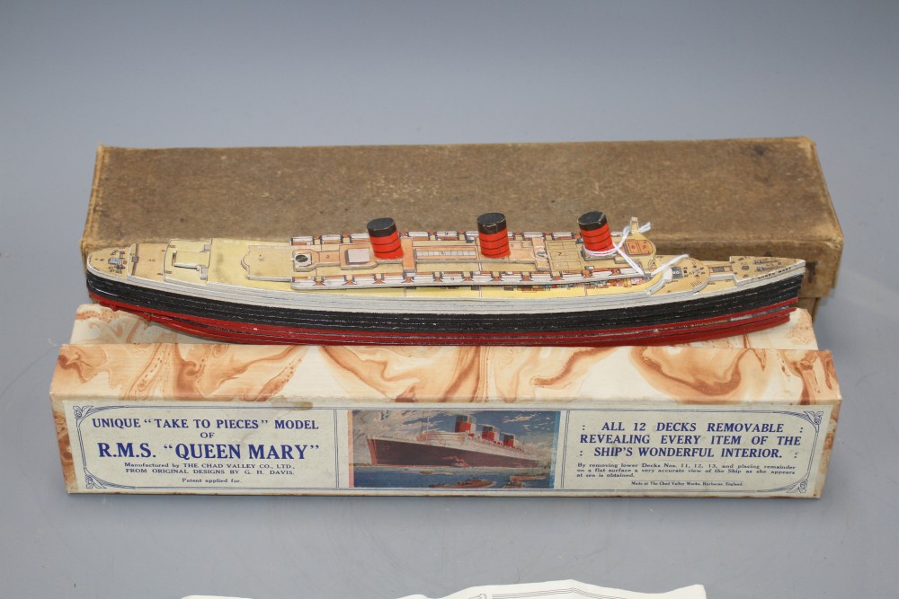 A boxed Chad Valley Unique Take to Pieces model of RMS Queen Mary, together with Keychart, marbled box and outer box,